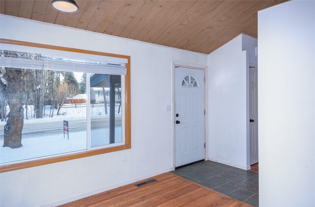 bonus room featuring lofted ceiling, wood ceiling, and hardwood / wood-style flooring