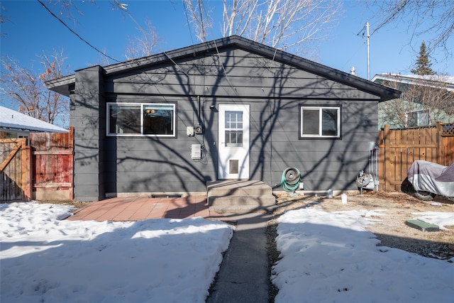 view of snow covered house