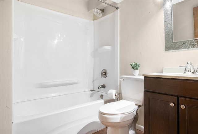 full bathroom featuring vanity, bathing tub / shower combination, and toilet