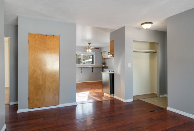 kitchen featuring dark wood-type flooring and ceiling fan