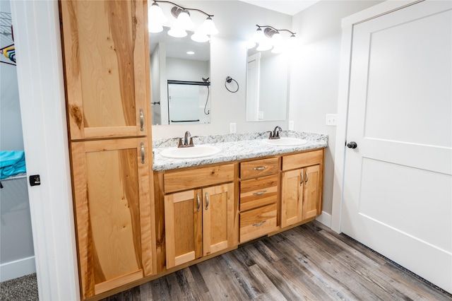 bathroom featuring vanity and hardwood / wood-style floors