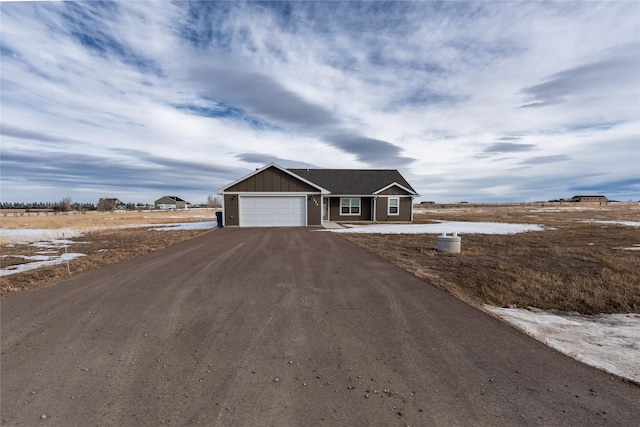 single story home featuring a garage