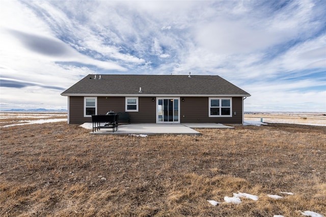 back of property featuring a patio area