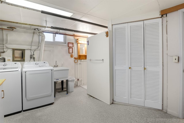 clothes washing area with washer and dryer