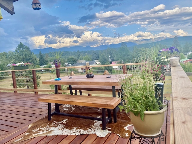 wooden terrace with a mountain view