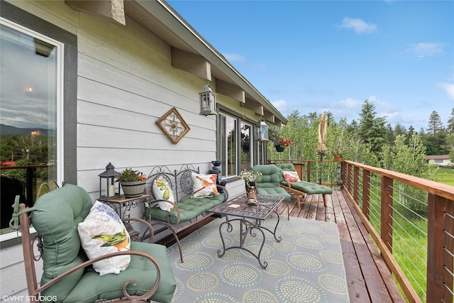 wooden deck featuring outdoor lounge area