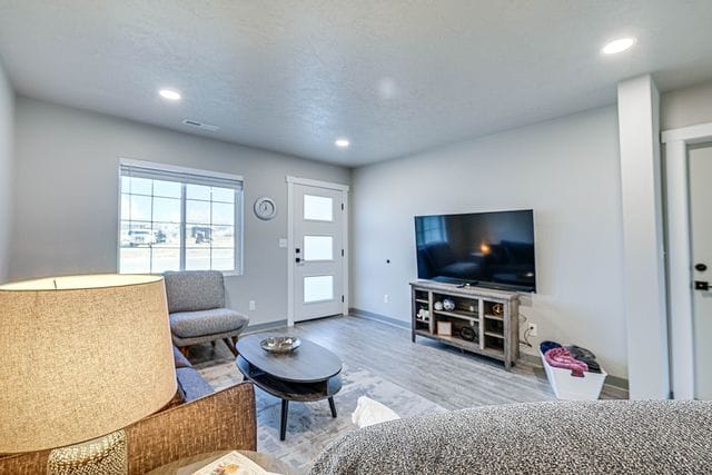 living room with light hardwood / wood-style floors