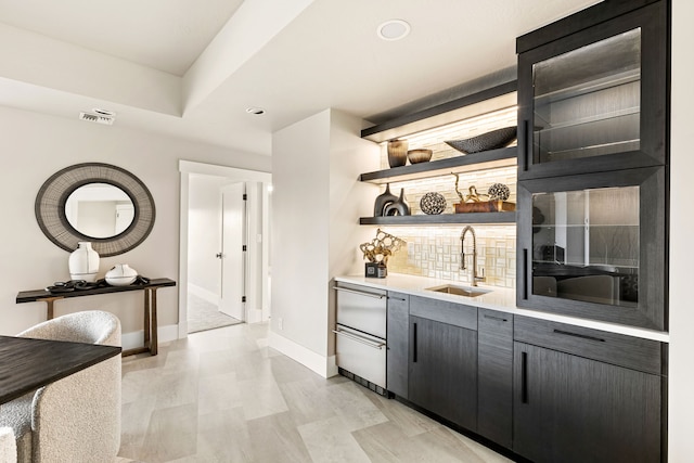 bar with tasteful backsplash and sink