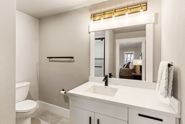 bathroom with vanity and toilet