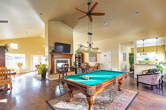 game room featuring billiards, wood-type flooring, high vaulted ceiling, a multi sided fireplace, and ceiling fan