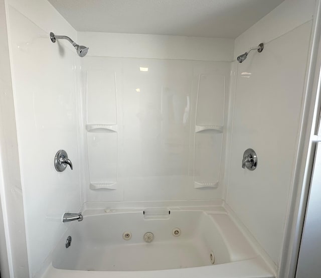 bathroom with bathing tub / shower combination