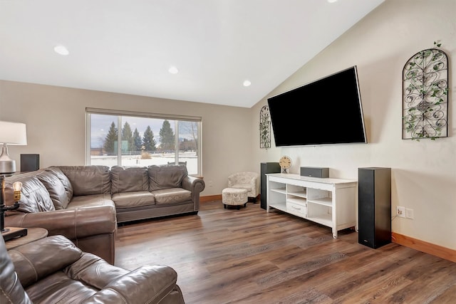 living room featuring lofted ceiling and dark hardwood / wood-style floors