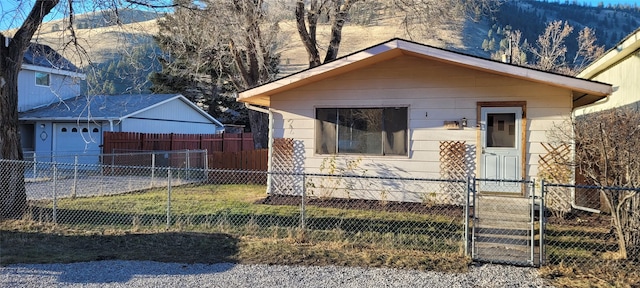 view of front facade with a garage and a front lawn