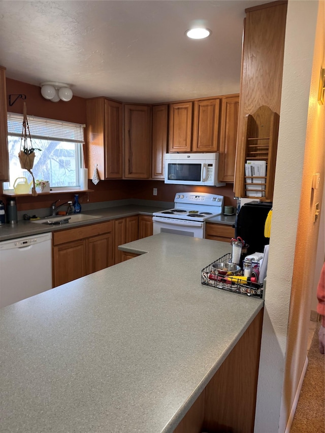 kitchen featuring sink and white appliances