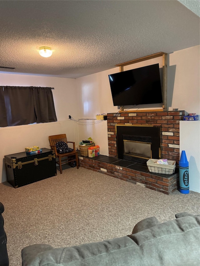 living room featuring carpet flooring, a brick fireplace, and a textured ceiling