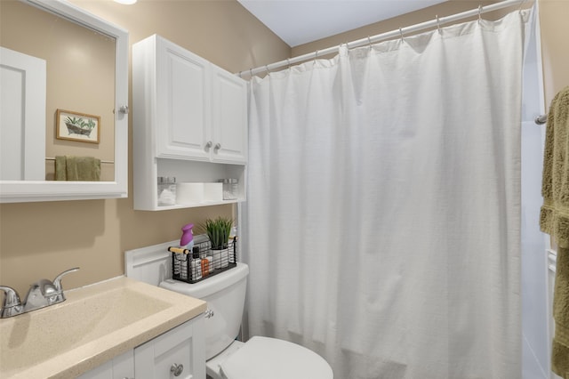 bathroom with vanity, toilet, and a shower with shower curtain