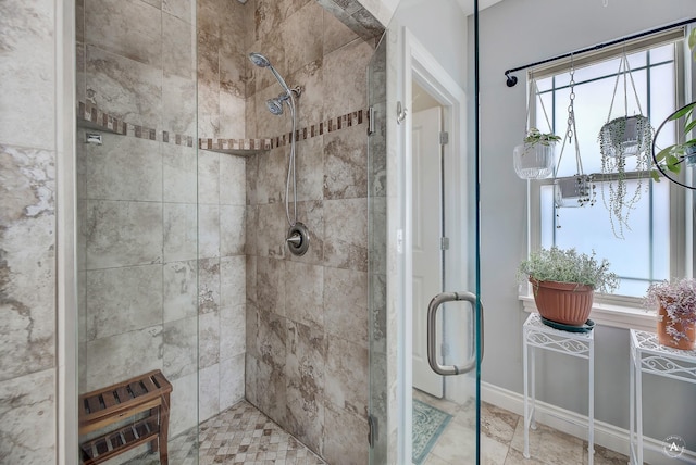 bathroom featuring a shower with door