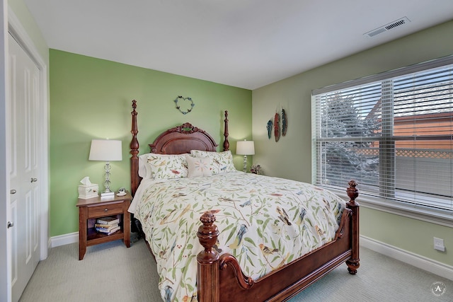 bedroom featuring light colored carpet