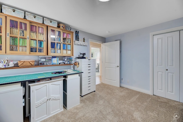 interior space featuring light colored carpet and white cabinets