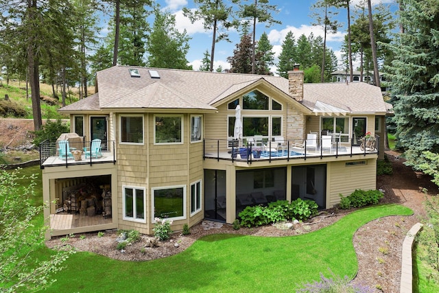 rear view of house with a yard