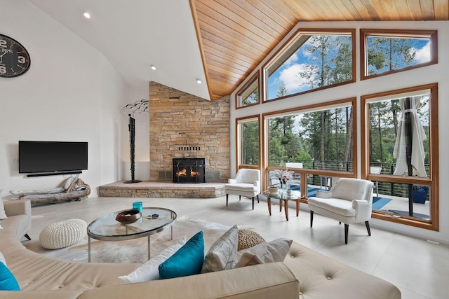 living room with high vaulted ceiling, a stone fireplace, wooden ceiling, and light tile patterned floors