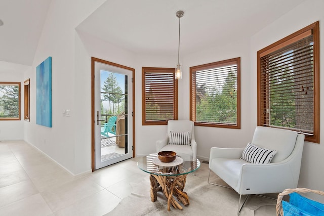 sitting room with a healthy amount of sunlight and light tile patterned floors