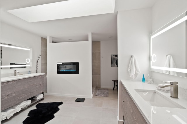 bathroom with vanity and a shower