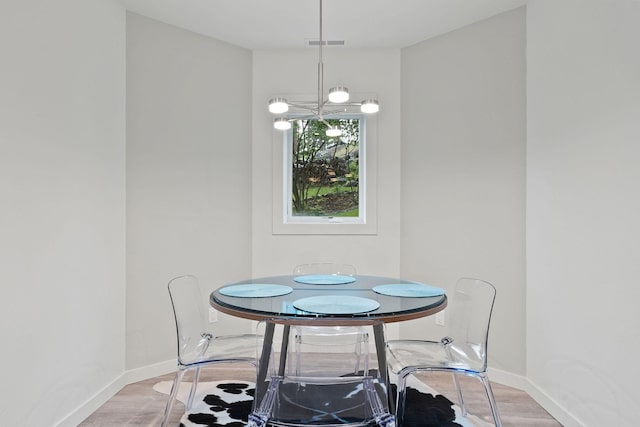 dining area featuring light wood-type flooring