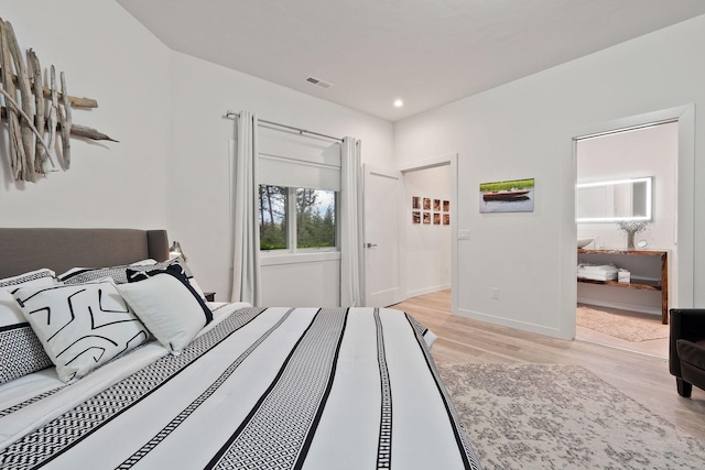 bedroom with light hardwood / wood-style floors