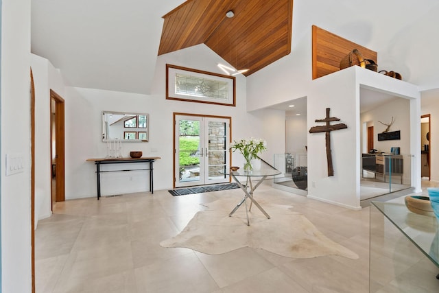 entryway with high vaulted ceiling, french doors, and wooden ceiling