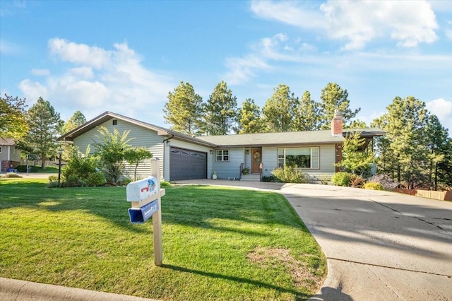 ranch-style house with a garage and a front lawn