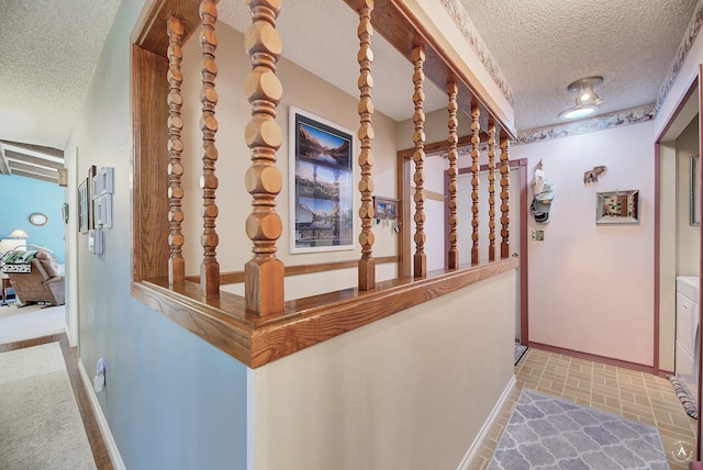 corridor with a textured ceiling