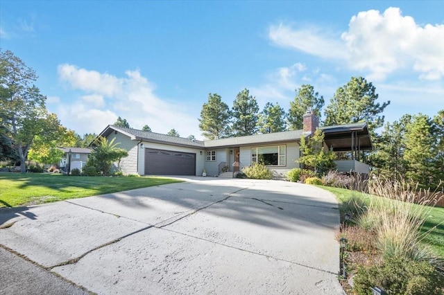 single story home featuring a garage and a front lawn