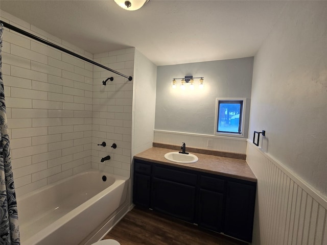 bathroom with vanity, shower / bathtub combination with curtain, and wood-type flooring