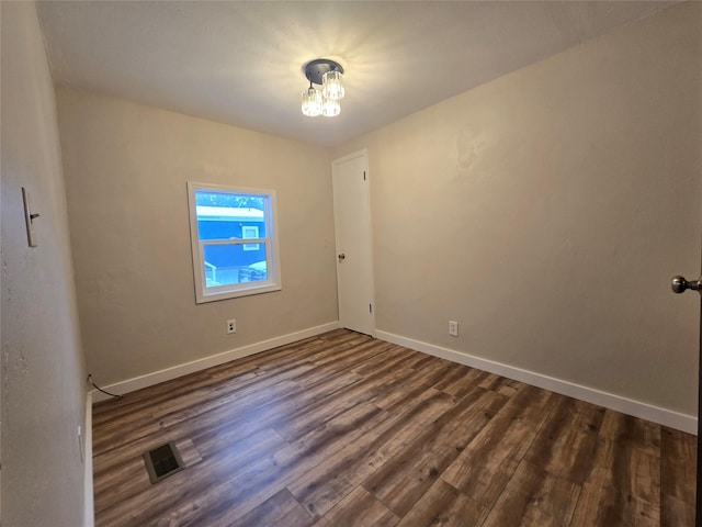 empty room featuring dark hardwood / wood-style floors