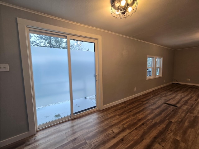 interior space with hardwood / wood-style flooring and crown molding