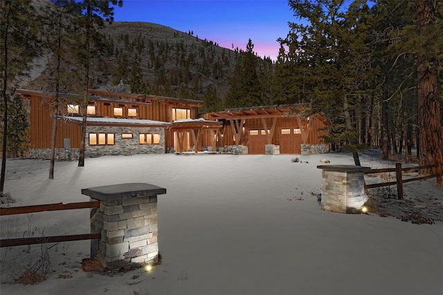 snow covered patio featuring a mountain view