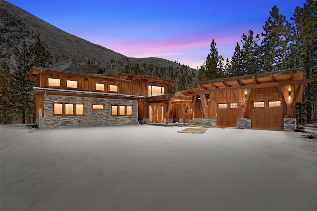 exterior space featuring a garage and a mountain view