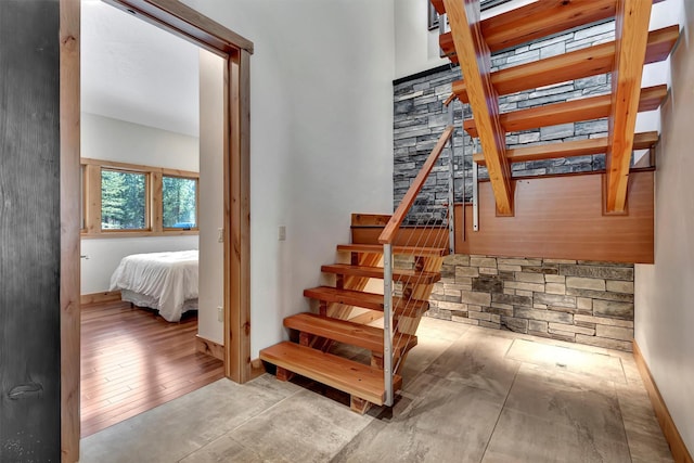 staircase with wood-type flooring