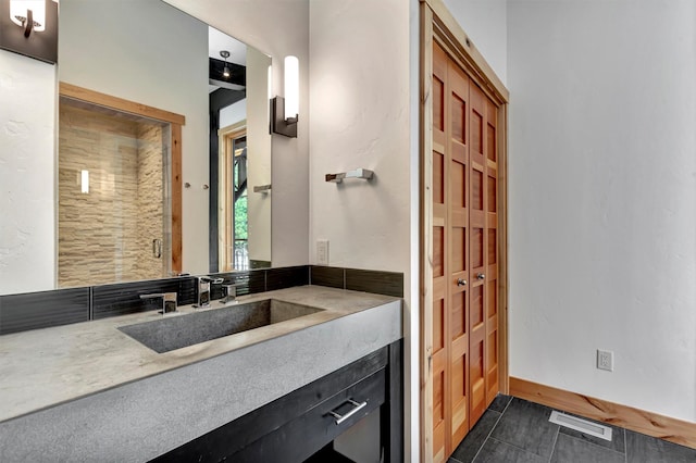 1180 Reardon Ln, Alberton, MT 59820 - full bathroom featuring vanity, a stall shower, and tile patterned flooring