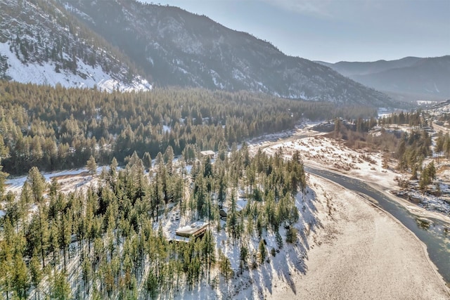 1180 Reardon Ln, Alberton, MT 59820 - aerial view of property and surrounding area featuring a heavily wooded area and a mountainous background