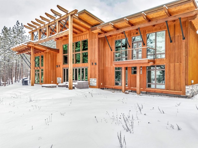 1180 Reardon Ln, Alberton, MT 59820 - snow covered back of property with board and batten siding