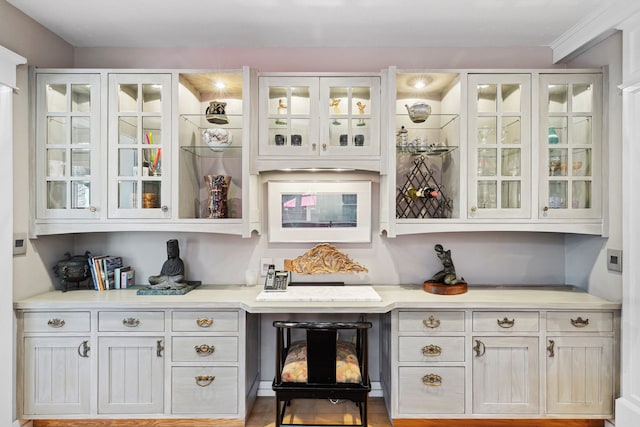 bar featuring white cabinetry