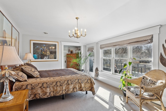 carpeted bedroom with a chandelier