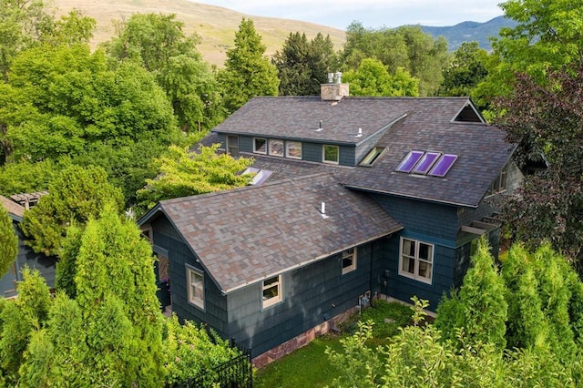 birds eye view of property featuring a mountain view