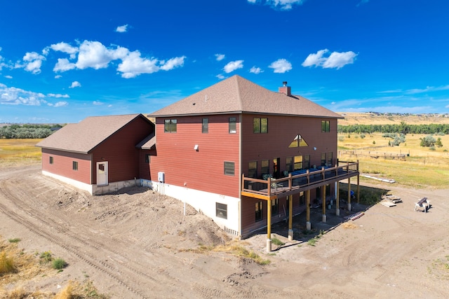 view of property exterior with a wooden deck