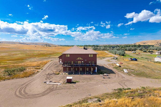 bird's eye view featuring a mountain view and a rural view