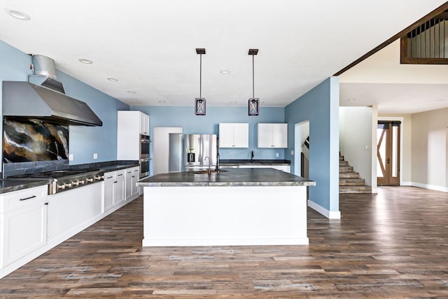 kitchen with stainless steel appliances, ventilation hood, pendant lighting, and white cabinets