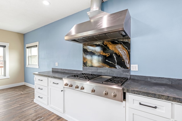 kitchen featuring white cabinetry, island range hood, stainless steel gas stovetop, and light wood-type flooring