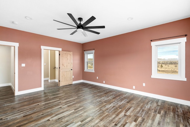 unfurnished bedroom featuring dark hardwood / wood-style floors and ceiling fan